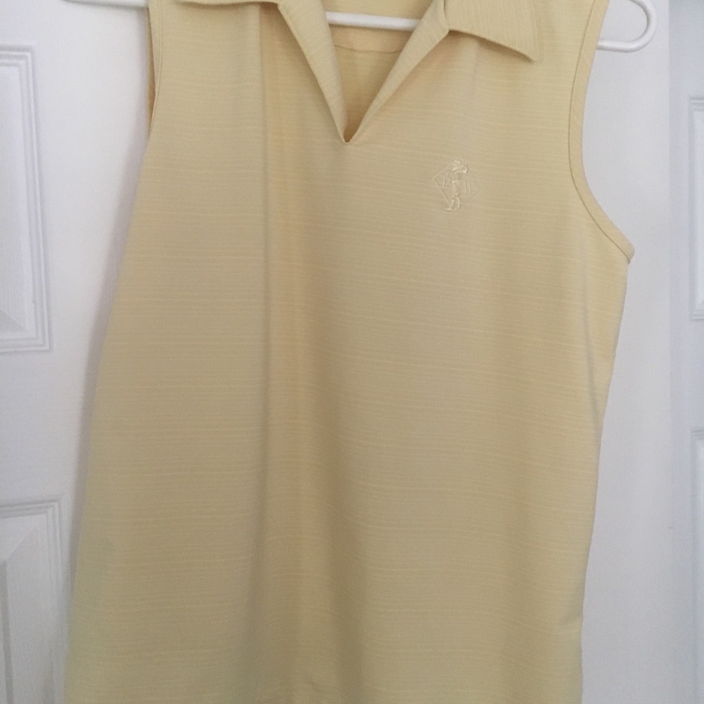 Yellow women’s Medium golf shirt.